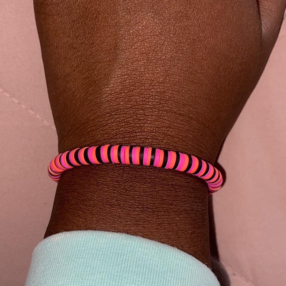 black, pink, and coral bracelet